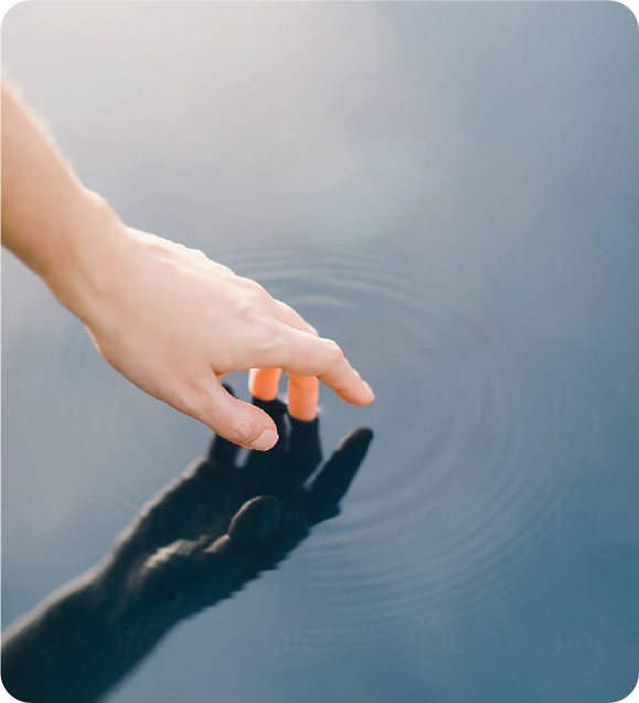 Hand gently touching water